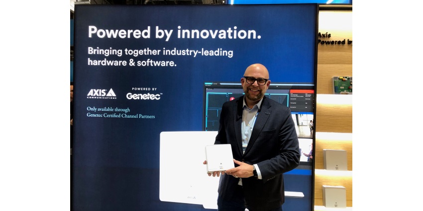 Andrew Elvish, Vice President, Marketing at Genetec, displays Axis network door controller ‘powered by Genetec’